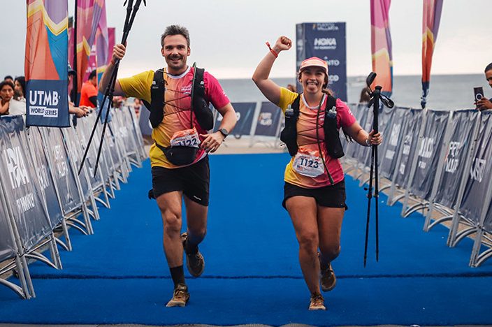 Dr. Bijan and Gabby crossing a race finish lane
